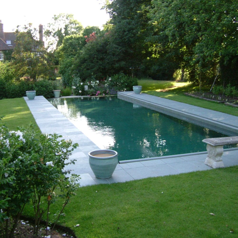 Outdoor swimming pool installation with bench