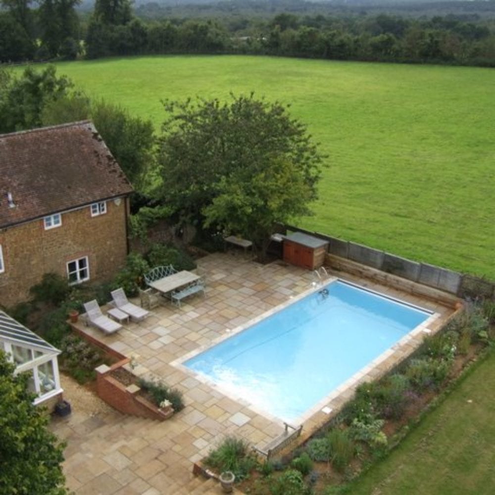 Aerial photo of swimming pool in back garden of Surrey home