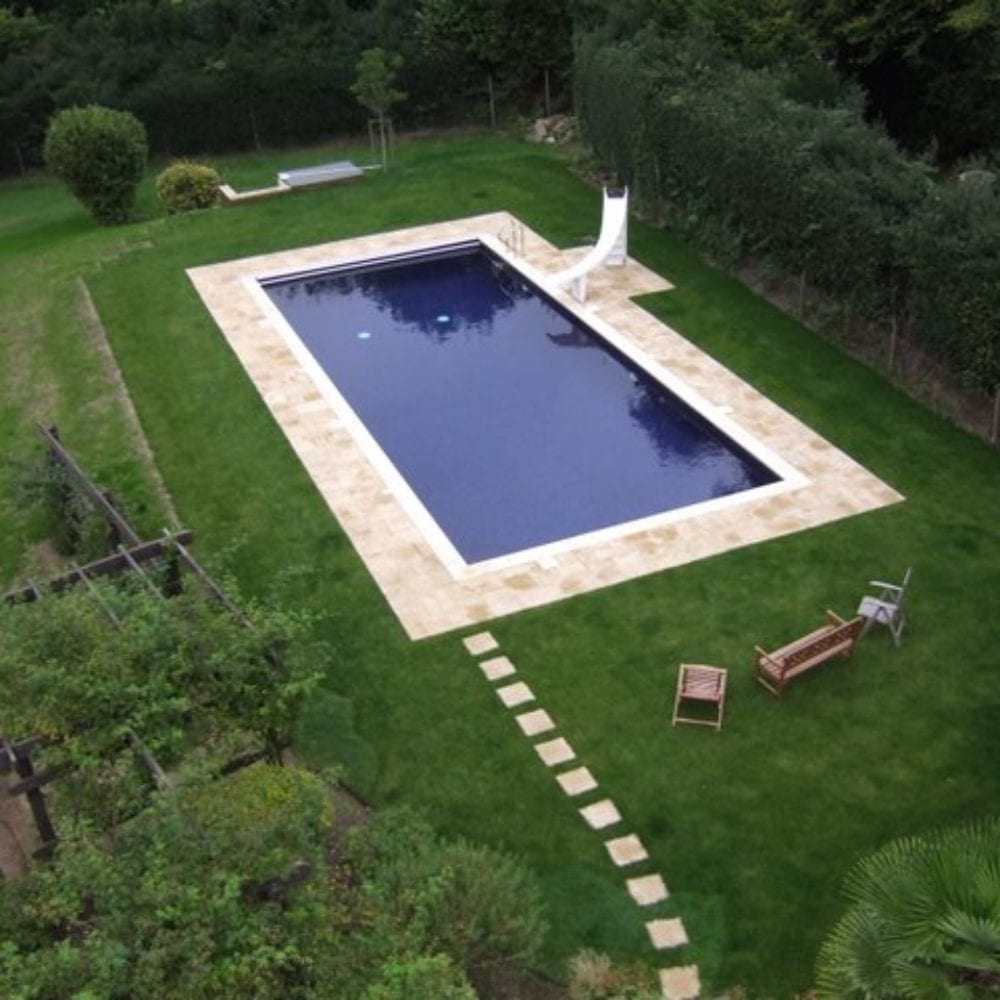 Aerial photo of swimming pool with paving and pathway