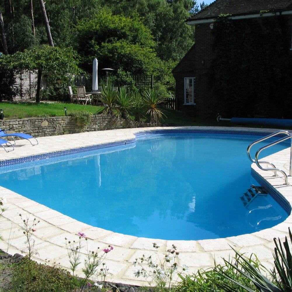 New Rounded Swimming Pool with Tiling in Surrey