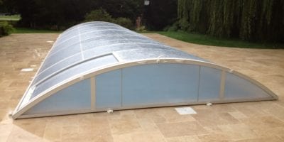 Outdoor pool enclosure on new pool paving