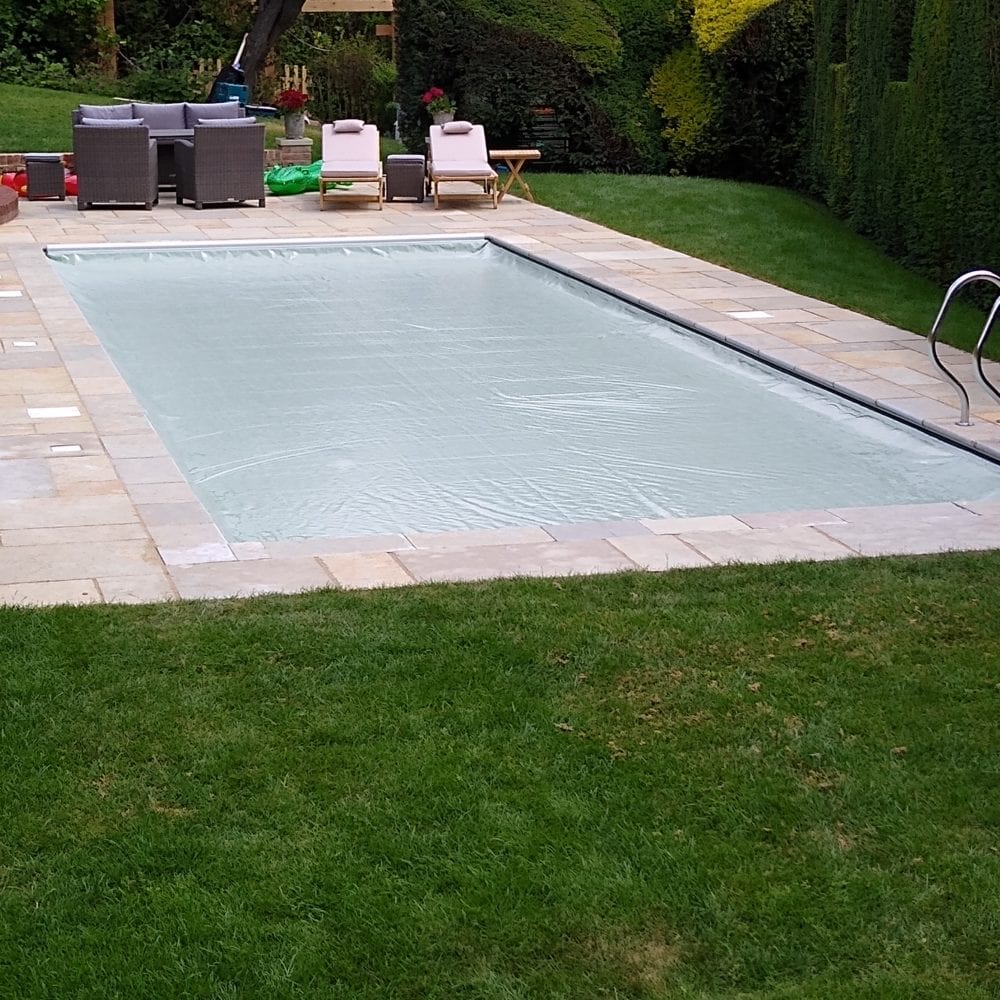 Covered outdoor swimming pool with grabrail