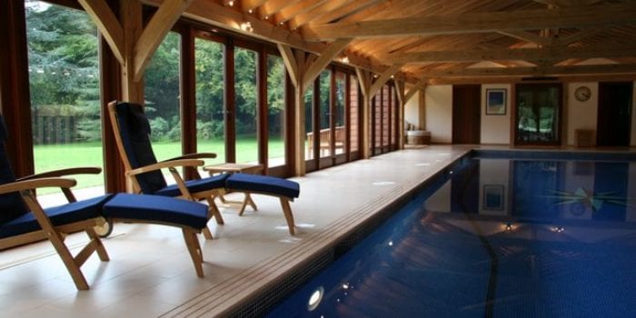 Indoor swimming pool with sunloungers