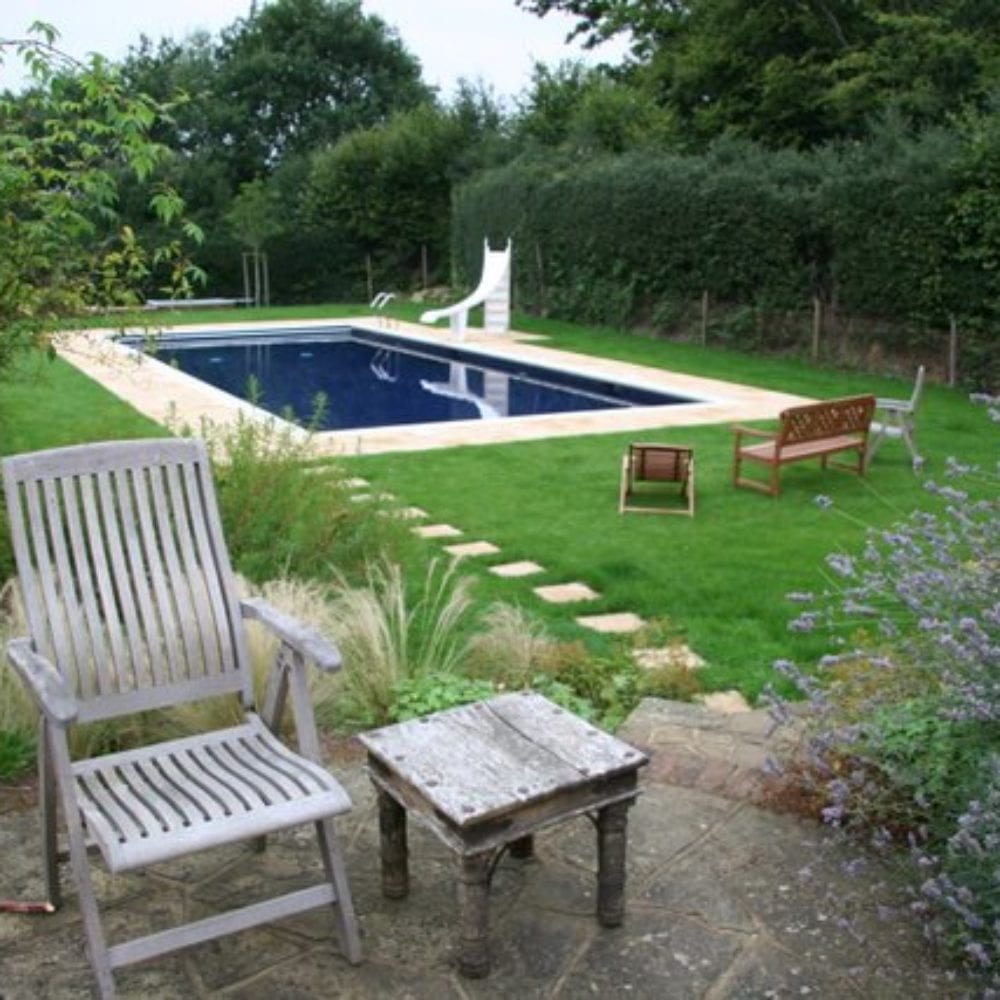 Outdoor swimming pool installation with pathway