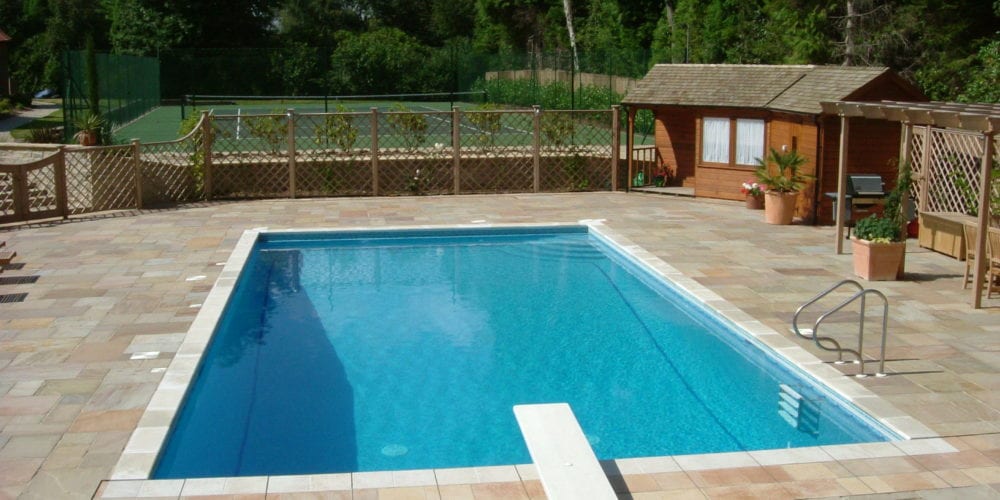 Outdoor swimming pool with copings and diving board