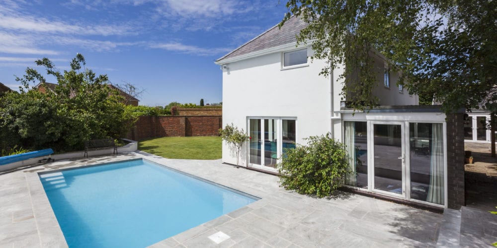Outdoor Pool in Back Garden with Simple Paving and Steps 2