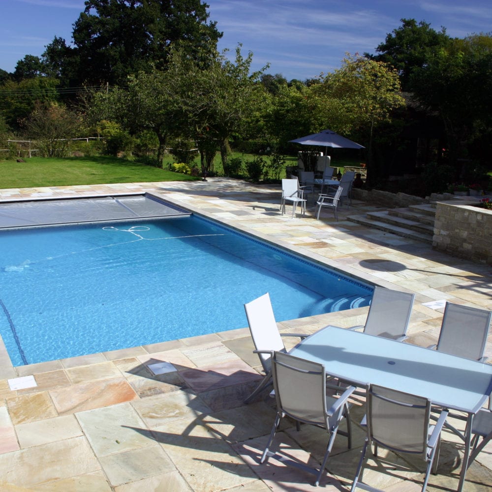 Outdoor Swimming Pool Installation with Chairs in Surrey