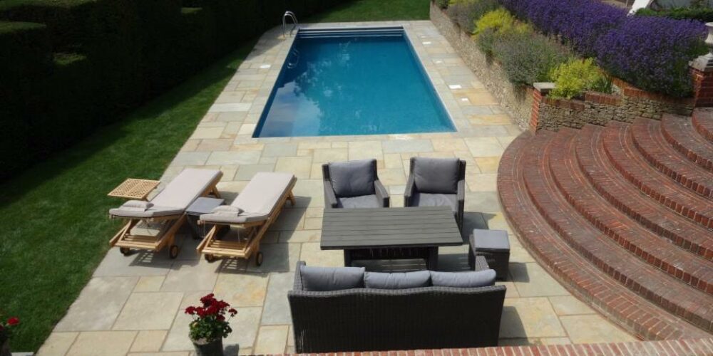 Simple Outdoor Swimming Pool with Paving and Outdoor Seating