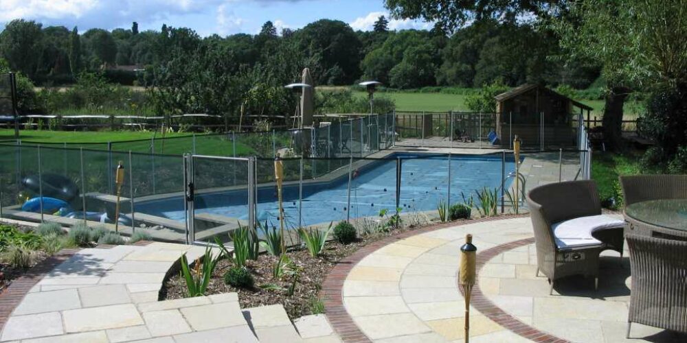 Swimming Pool with Safety Fencing in Garden