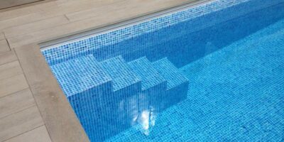 Close up of Mosaic Tile Outdoor Swimming Pool with Steps